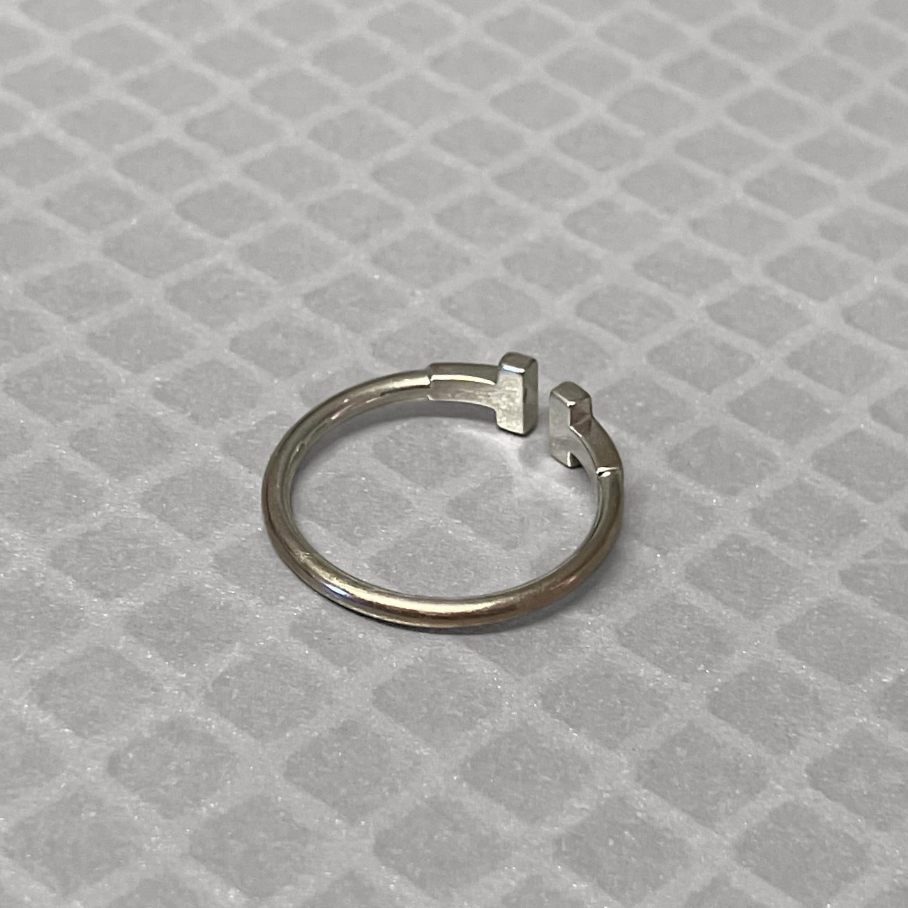 Preowned White Gold and Blue Sapphire Tiffany & Co. T Ring