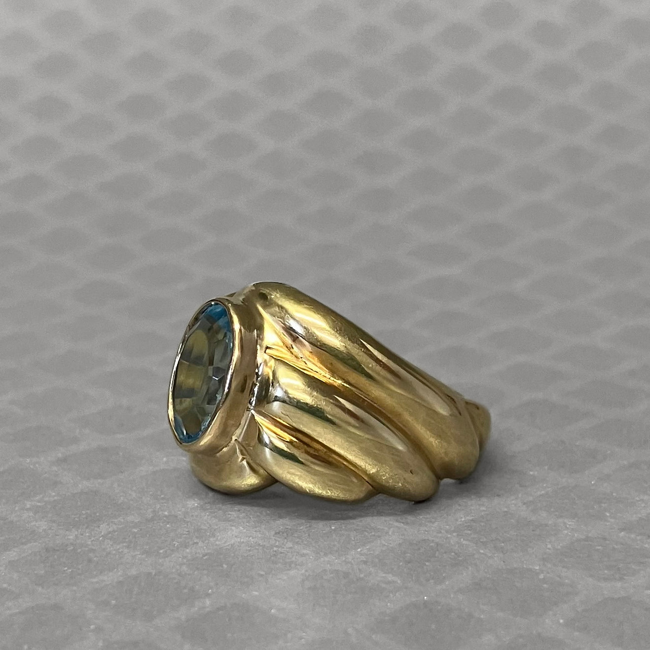 Preowned Yellow Gold and Oval Blue Topaz Ribbed Ring