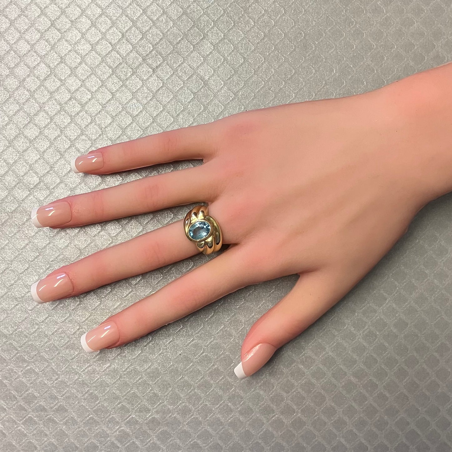 Preowned Yellow Gold and Oval Blue Topaz Ribbed Ring