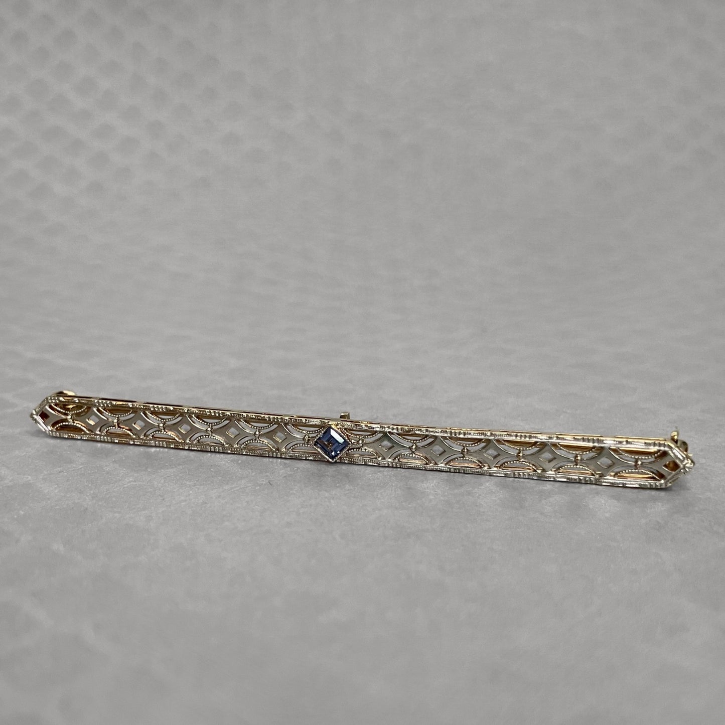 Preowned Platinum and Yellow Gold Blue Sapphire Krementz Bar Pin