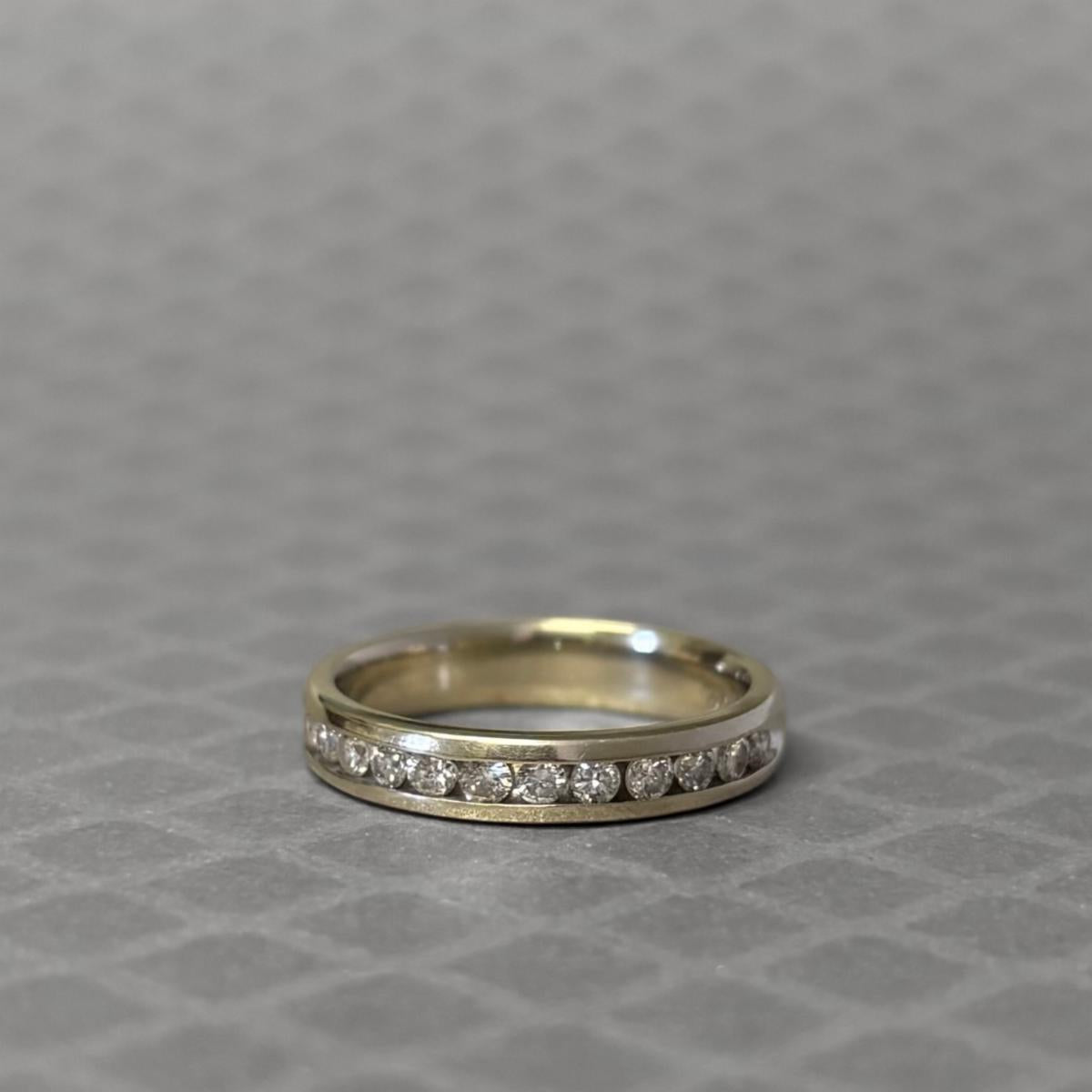 Preowned White Gold and Diamond Channel Set Band