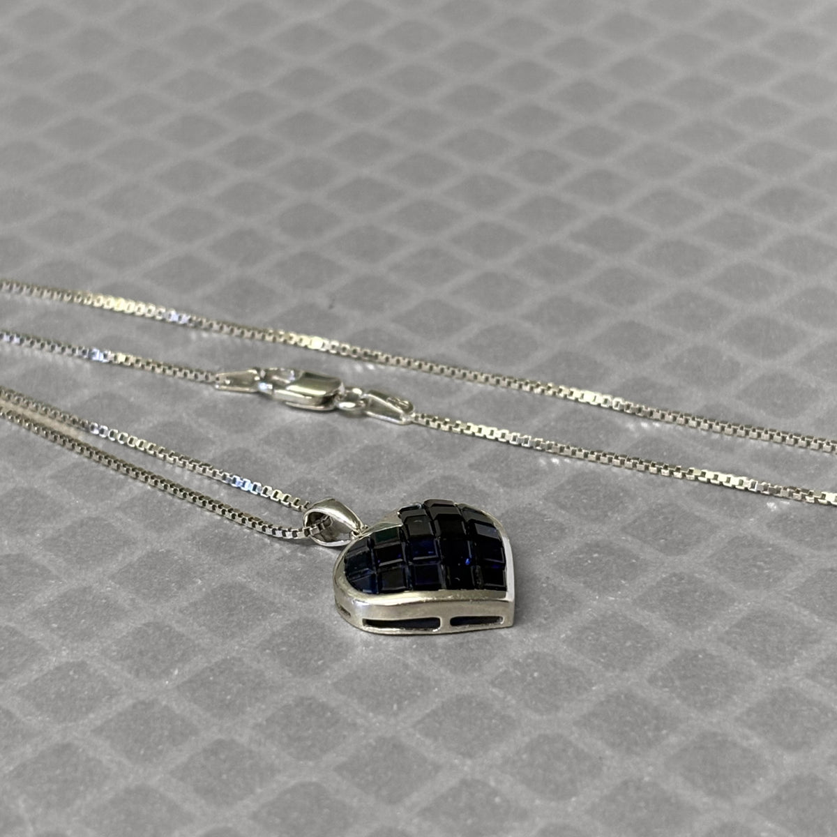Preowned White Gold and Invisible Set Blue Sapphire Heart Pendant