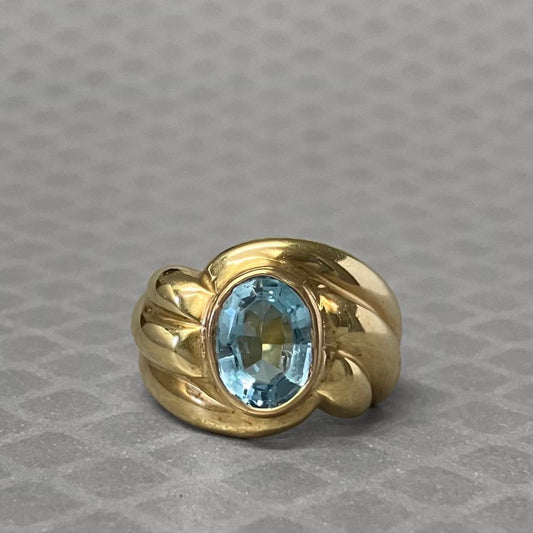 Preowned Yellow Gold and Oval Blue Topaz Ribbed Ring