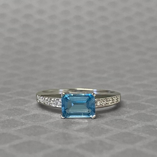 Preowned White Gold Emerald Cut Blue Topaz and Diamond Ring