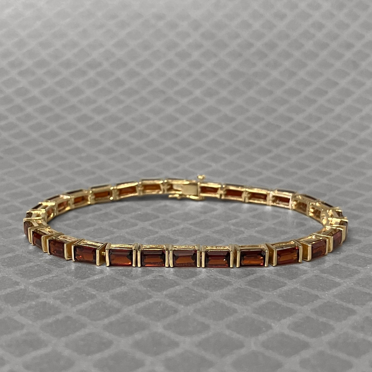 Preowned Yellow Gold and Emerald Cut Garnet Bracelet